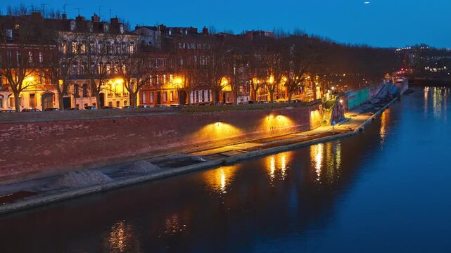 Tounis wharf is street in Toulouse, France on edge of Garonne from Pont-Neuf, at corner of Rue de Metz and Quai de la Daurade, to Tounis towing bridge.
