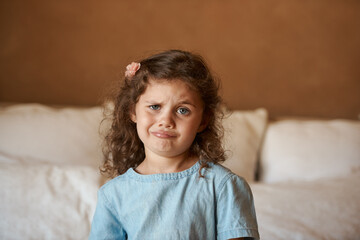 Home, portrait and kid with silly face in bedroom for playful humor, joke and funny expression....