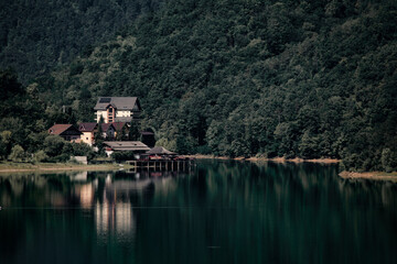 Forest reflection on a clear lake in Hunedoara, Romania