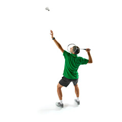 Full-length image of young men, badminton player serving shuttlecock with racket, practicing, preparing for game isolated on white background. Sport, competition, active and healthy lifestyle concept