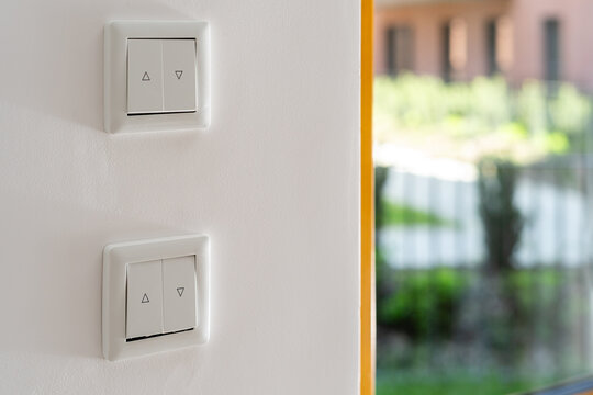 Wall mounted light switches and roller shutter system for window blinds