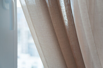 Linen curtains close-up. Light curtains of linen .