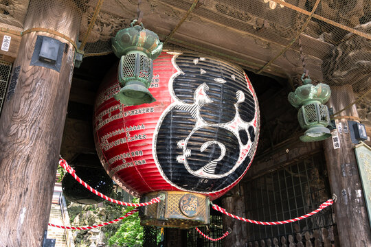 Narita, Japan - July 23 2024: Traditional Japanese lantern that lies in the Niomon Gate of the Buddhist Naritasan Shinsho-ji temple near Tokyo in Japan.