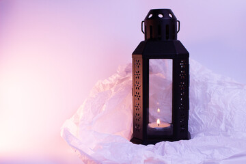 This black metal lantern with a glass panel creates a spooky, flickering glow when lit with the...
