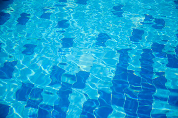 A blue pool shines on a summer day
