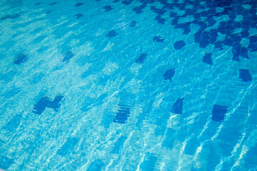 Blue swimming pool background. Long banner of water surface in pool.