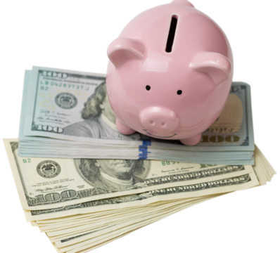 Pig piggy bank on the background of 100 US dollar bills and physical coins of bitcoins