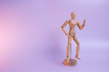 A minimalist wooden figure with a simple, abstract human form. The smooth, polished wood has a warm, natural tone and texture. A calming, meditative presence.