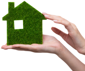 Female hands hold a model of a green house close-up. Sale of ecological real estate of the future.