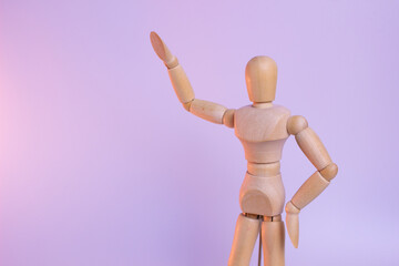 A minimalist wooden figure with a simple, abstract human form. The smooth, polished wood has a warm, natural tone and texture. A calming, meditative presence.