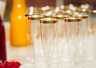 close up of champagne glasses on a table for mimosas