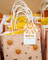 close up of colorful thank you bags on a table