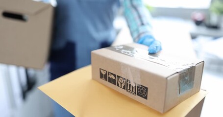 Courier delivery man hands over boxes with parcels. Working as courier concept - Powered by Adobe