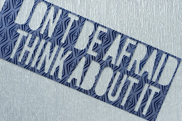 machine-cut stencil with the phrases 