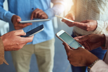 Hands, employees and technology in office for networking with communication and connection. Business, people and sharing information or data with texting on social media with coworking on research