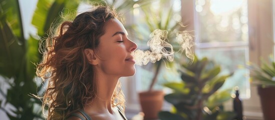 Woman inhaling essential oil at a yoga retreat. with copy space image. Place for adding text or design
