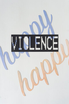 contradictory or paradoxical sign: violence over happy