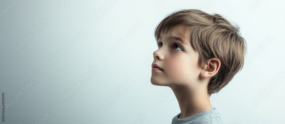 Poster thoughtful child with short hair set against a white background. with copy space image. place for ad