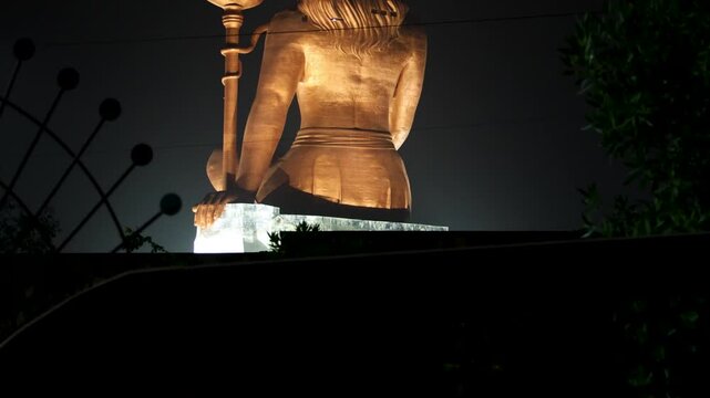 back view of hindu god lord shiva isolated statue at night from different angle