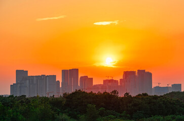 sunrise over modern office building skyline of cityscape