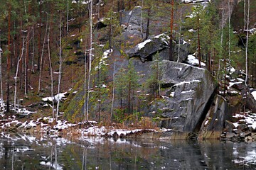 Autumn gloomy forest on the slope of the Ural Mountains