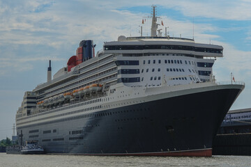 Legendary luxury ocean liner Queen Mary 2 cruiseship cruise ship at Steinwerder terminal in Hamburg port, Germany on sunny day