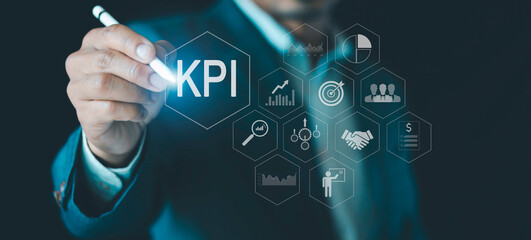 Businessman analyzing Key Performance Indicators, (KPI) with various graphs, charts, showcasing data analysis, performance tracking, business planning, measuring success, target achievement.