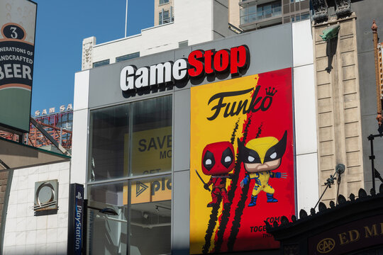 exterior building facade and signage of GameStop, a video game store chain, located here at 267 Yonge Street in downtown Toronto, Canada