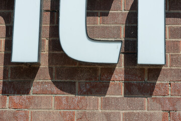 close-up of channel lettering sign on a brick wall