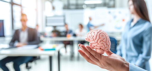 Businessman holding a brain icon with an office background, in the style of a digital twin concept of human interface technology for creative thinking and intelligence. A business manager or employee 