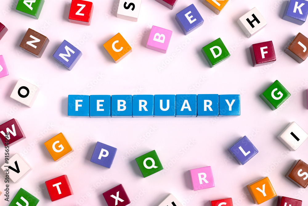 Wall mural february word written on colorful cubes, month concept