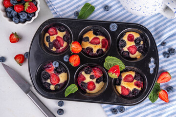 Portioned Mixed Berry Sheet Pan baked Pancakes, simple idea recipe in muffin tins. with fresh...