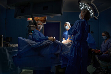 Doctor and assistants in the operating room for surgical hospital