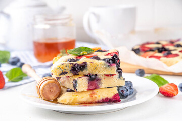 Mixed Berry Sheet Pan baked Pancakes, simple idea recipe. with fresh blueberry and strawberry, copy space