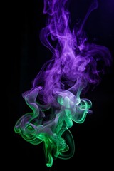 Obraz premium Abstract colorful smoke art in purple and green hues on a dark background.