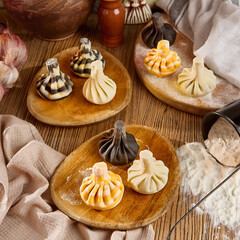 Assorted Khinkali Dumplings on Wooden Platters