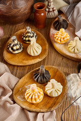 Assorted Khinkali Dumplings on Wooden Plates – Colorful Traditional Georgian Cuisine Display