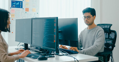 Group Adult Asia male, female freelance typing write prompt AI bot IT app smart program nomad, video game, terminal with coding language, user interface, designer, big data center on desktop computer.