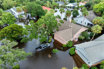 Fototapeta na wymiar Hurricane Debby flooded homes and cars in residential community in Sarasota, Florida. Aftermath of natural disaster