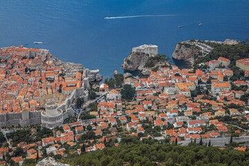 Dubrovnik, Croatia. Overview of the medieval old town with fortified walls and the tourist harbor....
