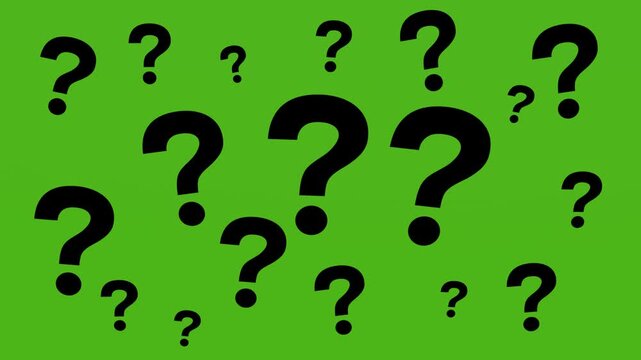 a large number of question marks on the green screen