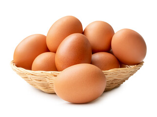 Front view of fresh brown chicken eggs in stack in wicker basket isolated on white background with clipping path