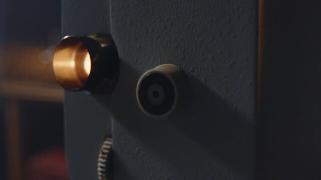 Indepth view showcasing intricate elements of vintage projector, highlighting its classic design and functionality