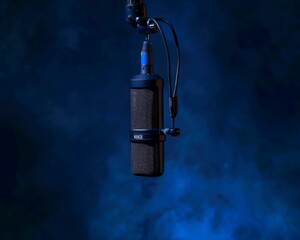 Studio Shot of Black Rode NT1 Microphone on Cord with Dark Blue Background