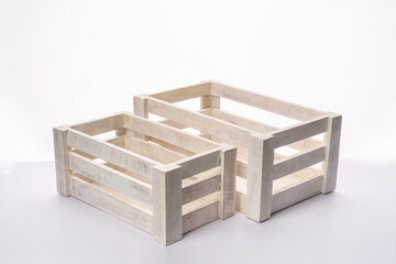 Empty wooden storage boxes on white background, white texture crate boxes for fruits and vegetable...