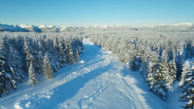 Aerial view, wide shot of a snowy landscape, of a typical winter vacation spot with no people. Slow Motion. No people. antarctica, peaceful, norway, scandinavia, canada, snowing, snowboard, idyllic