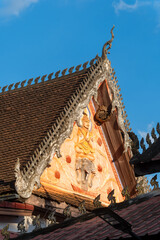 detail of the decoration on the pediment of an annex of Wat Si Saket features in Vientiane, Laos