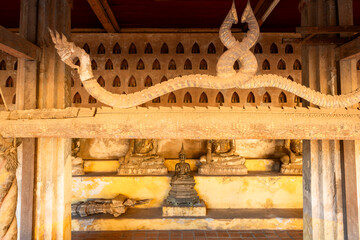 Fototapeta premium Buddhist wooden gutter for watering Buddha statues during Lao New Year in Wat Si Saket features in Vientiane, Laos