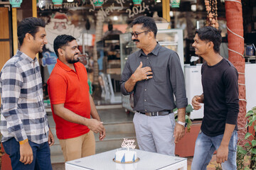 Friends having fun together at a cafe, sharing laughter and smiles in the warm sunlight
