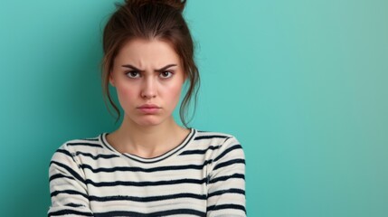 Fototapeta premium Woman looking suspiciously at camera on blue background
